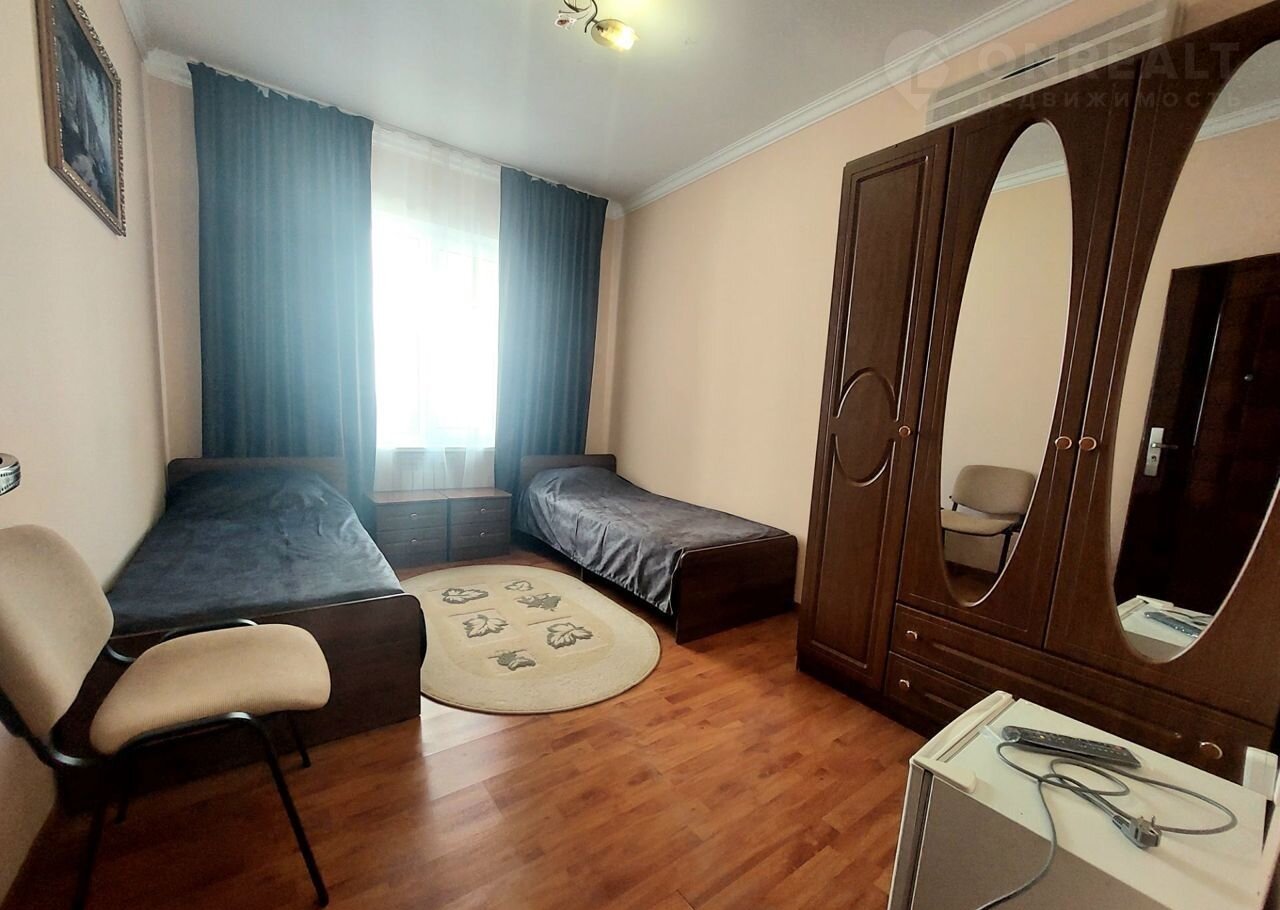 Simple shared room arranged for group accommodation.